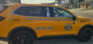 Professional Grande Prairie taxi service with distinctive taxi top light